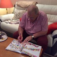A man doing devotional colouring - Buy Online here